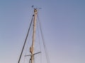 Yacht mast with rigging, stays and windex on top Royalty Free Stock Photo