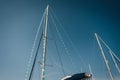 Yacht masts in blue sky background