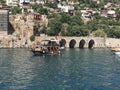 yacht in the Mediterranean near the old castle and tunnel Royalty Free Stock Photo