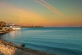 Yacht moored at seashore near island of Corfu at sunset