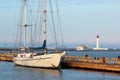 Yacht moored to a pier at sea marina Royalty Free Stock Photo