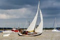 Yacht navigating the river under sail