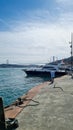 Yacht near the pier. Fatih Sultan Mehmet Bridge across the Bosphorus in Turkey Royalty Free Stock Photo