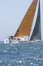 Yacht With Orange Sail Competes In Team Sailing Event