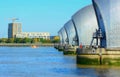 Yacht passing through River Thames Barrier. Royalty Free Stock Photo