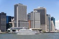 Yacht passing by the Staten Island Ferry Port area in Lower Manhattan, NYC. Royalty Free Stock Photo