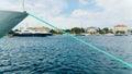 Yacht with rope tied to pier