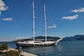 A yacht with it`s rigging down, moored in the marina at Marmaris in Turkey Royalty Free Stock Photo