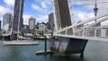 Yacht sail through Wynyard Crossing bridge in Auckland