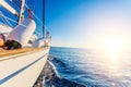 Yacht Sailing against sunset. Sailboat. Travel Concept