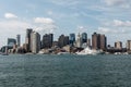 Yacht and sailing boats on Charles River in front of Boston Skyline in Massachusetts USA on a sunny summer day Royalty Free Stock Photo