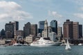 Yacht and sailing boats on Charles River in front of Boston Skyline in Massachusetts USA on a sunny summer day Royalty Free Stock Photo