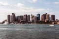 Yacht and sailing boats on Charles River in front of Boston Skyline in Massachusetts USA on a sunny summer day Royalty Free Stock Photo