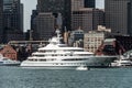 Yacht and sailing boats on Charles River in front of Boston Skyline in Massachusetts USA on a sunny summer day Royalty Free Stock Photo