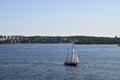 Yacht sailing through the calm, blue waters of the Baltic Sea along the shores of Stockholm during sunset Royalty Free Stock Photo