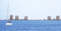 Yacht sailing through the mediterranean sea against La Manga coast, during season of Summer. Yachting as a seasonal activity to