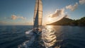 Yacht sailing in open sea at sunset. Tropical seascape. Suitable for travel brochures, maritime themes, or as a background about Royalty Free Stock Photo