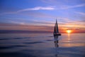 Yacht sailing at sunset Royalty Free Stock Photo