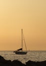 Yacht sailing at sunset