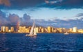 Yacht sailing at sunset in Waikiki Royalty Free Stock Photo