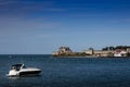 Yacht sailing towards sunset in blue background, Royalty Free Stock Photo