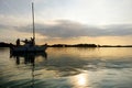 Yacht sailing towards sunset on Trakai lake Royalty Free Stock Photo