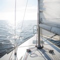 Yacht sailing towards the sunset Royalty Free Stock Photo