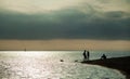 The yacht sailing on the waves of the sea bay, people sitting on Royalty Free Stock Photo