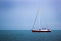 Yacht sailing at waves of the sea. Nautical landscape with sailboat - cruising yacht sailing under full sail taking part in regatt