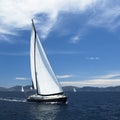 Yacht sails with beautiful cloudless sky. Luxury yacht.