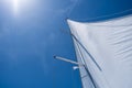 Yacht sails on clear blue sky background. Sailing with the wind at open sea ocean, summer holidays Royalty Free Stock Photo