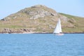 A yacht in the sea with Lambay Island in the Irish Sea. Landscapes of Ireland.