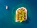 Yacht at sea near the small Island at the port entrance in Vathy Ithaka