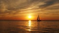Yacht and orange sunset on sea