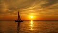 Yacht on sea at orange sunset