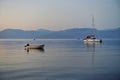 Yacht and Small Boat Moored in Gulf of Corinth Bay, Early Morning Dawn, Greece Royalty Free Stock Photo