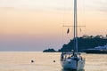 Yacht at sunset. A yacht in the sea bay against the backdrop of a beautiful sunset. Travel and romance concept Royalty Free Stock Photo