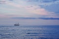 The yacht with the sunset time in the Baltic Sea. Sail boat with beautiful sky, clouds. Royalty Free Stock Photo