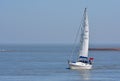 Yacht under sail at the estuary of the river Deben at Felixstowe Ferry. Royalty Free Stock Photo