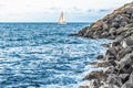 A yacht with white sails sailing on the blue water of the Atlantic Ocean Royalty Free Stock Photo