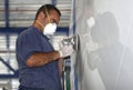 Yacht worker polishing hulk Royalty Free Stock Photo