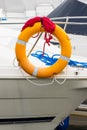 Yachting, blue and red rope with orange lifebuoy on sailboat