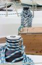 Yachting, coiled rope on sailboat, details of yacht Royalty Free Stock Photo