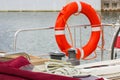Yachting, colorful rope with orange lifebuoy on sailboat