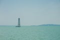 Yachting, luxury, sailing, cruise concept. A sailboat is waiting in day stillness under beautiful blue sky with clouds on Lake Bal