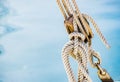 Yachting, nautical maritime pulley with ropes at harbor marina with sea water