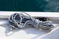 Yachting rope on the sailing boat bow, blur sea water background Royalty Free Stock Photo