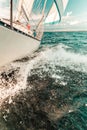 Yachting on sail boat bow stern shot splashing water Royalty Free Stock Photo