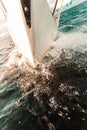 Yachting on sail boat bow stern shot splashing water Royalty Free Stock Photo