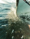 Yachting on sail boat bow stern shot splashing water Royalty Free Stock Photo